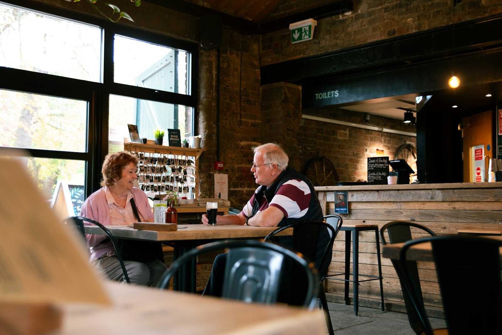 An older couple enjoying a relaxed meal out together
