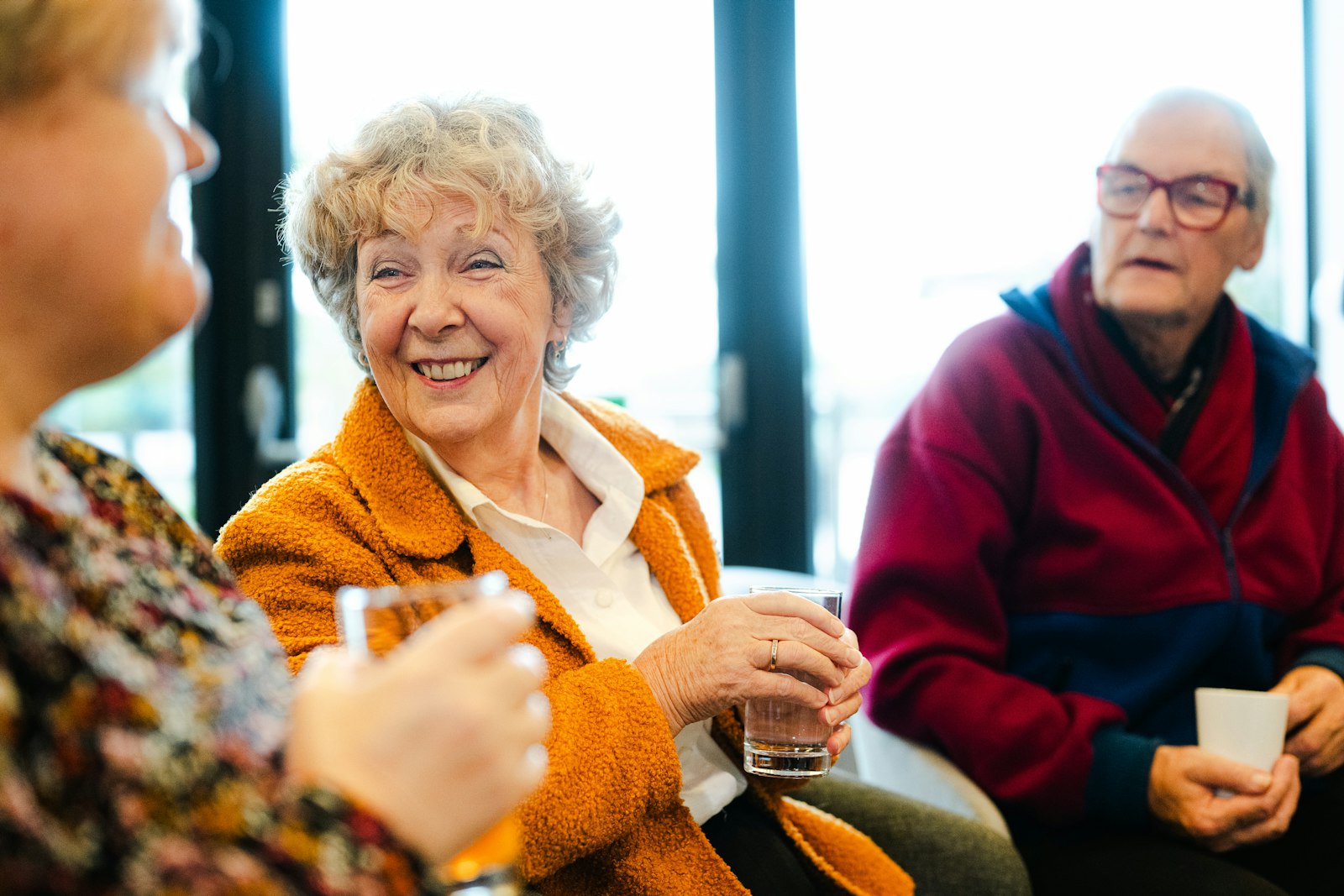 Friends laughing together over coffee