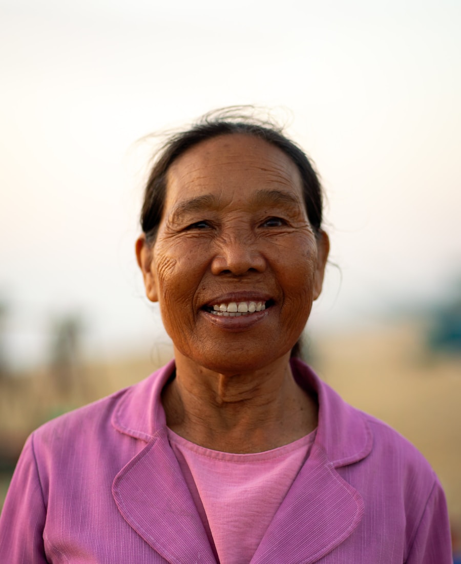An older woman with a bright, unguarded smile